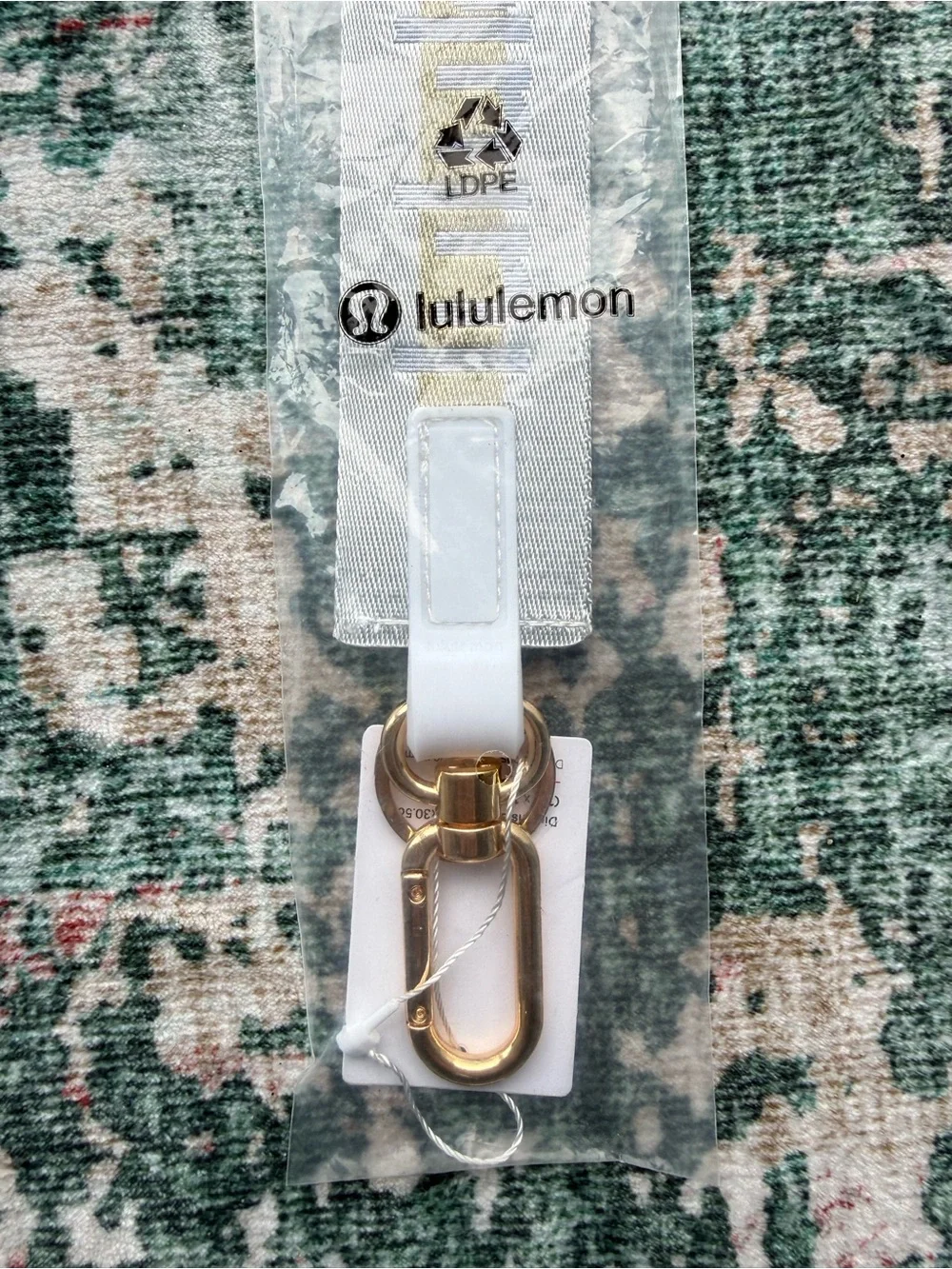 lululemon athletica Never Lost Keychain Lanyard in light grey with Gold Logo